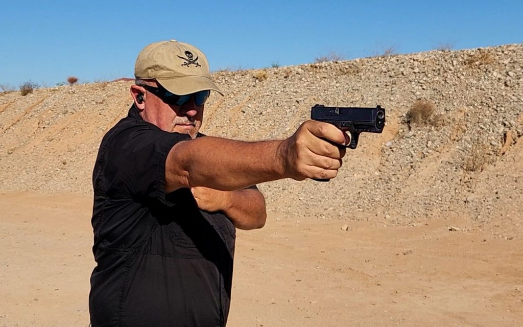 Author, Fred Mastison, on the range testing the Anderson Kiger 9C handgun, newly released  