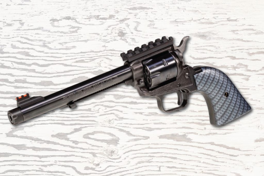 Cowboy Action Guns: Heritage Arms Rough Rider Tactical Cowboy .22, racy gray carbon-fiber grips, Picatinny rail, red fiber-optic front sight, and suppressor-ready 6-1/2” barrel.  Find it on GunBroker.com