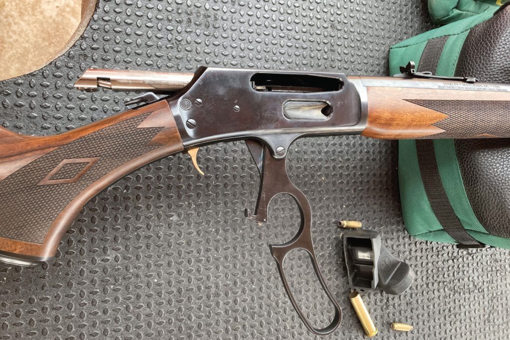 Marlin Model 336, traditional gold-plated trigger, pistol grip buttstock, and a crossbolt safety. Find it on GunBroker.com