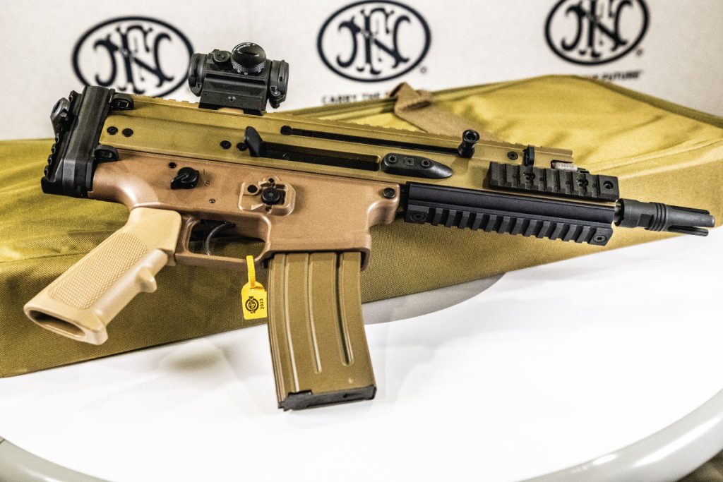 The FN SCAR 15P features a non-reciprocating bolt carrier assembly that enables all shooting positions, charging handles double as hand stops, and a short-stroke gas piston. Find it on GunBroker.com
