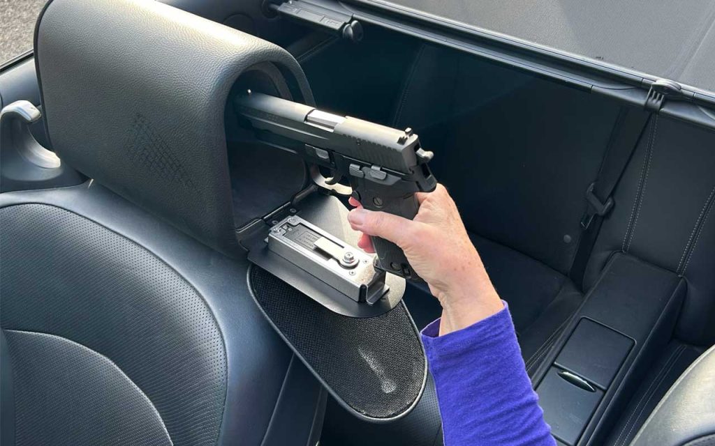 Removing a handgun from the Headrest Safe