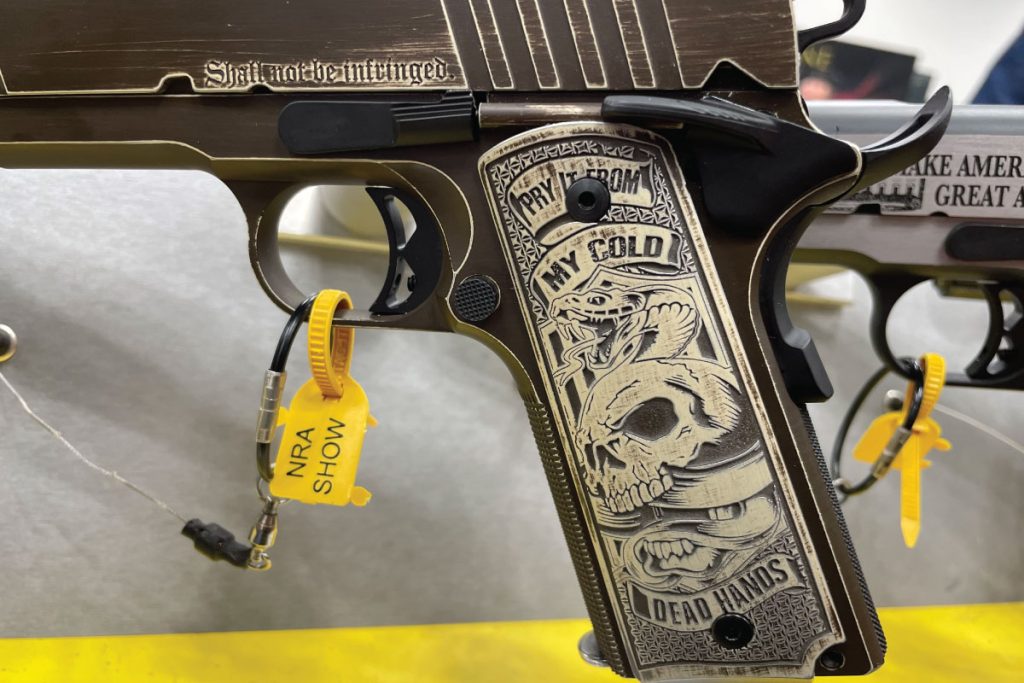 Grip closeup of Auto-Ordnance Cold Dead Hands 1911 Handgun - GunBroker.com
