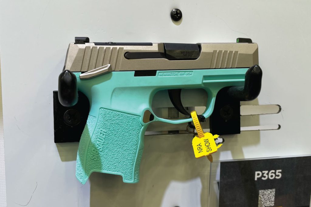 SIG P365-380 model features a stainless slide, along with a nickel-finished magazine catch, manual safety lever, slide catch, and takedown lever paired with a unique Robins Egg Blue grip module. - GunBroker.com