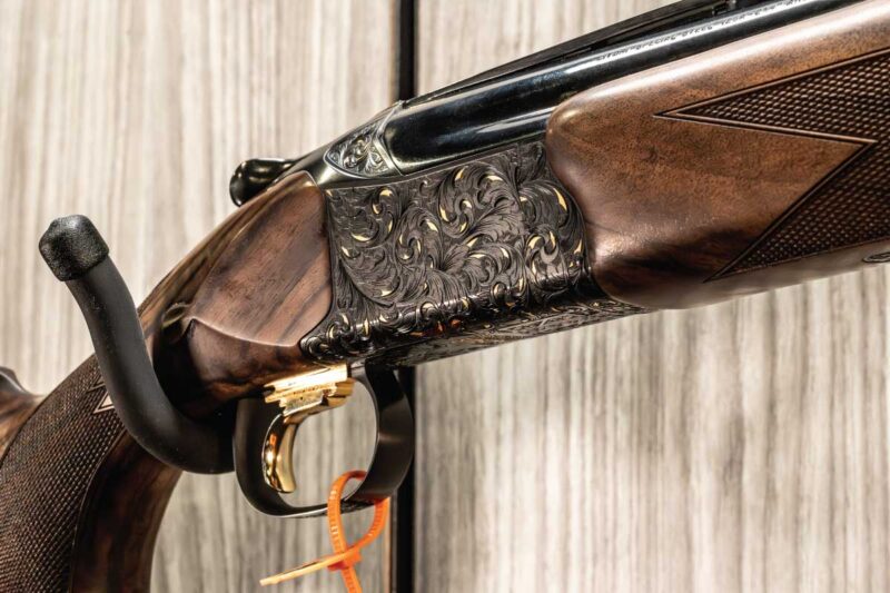 Browning B-15 Grade E over/under showcasing hand-chased engraving inspired by the classic Superposed.