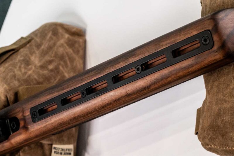 The Woox Elegante stock includes a six-slot M-LOK panel for lights, bipods, and accessories.