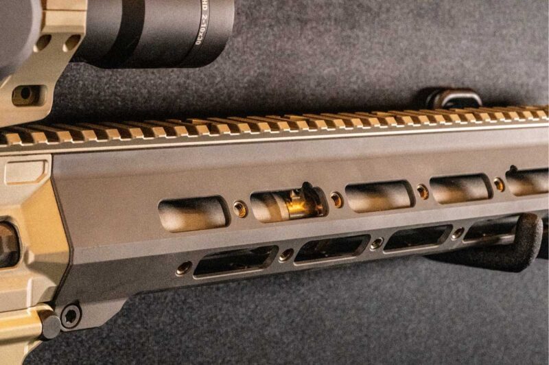 The integrated receiver and rigid handguard system provide enhanced durability and improved mounting stability for optics and accessories.