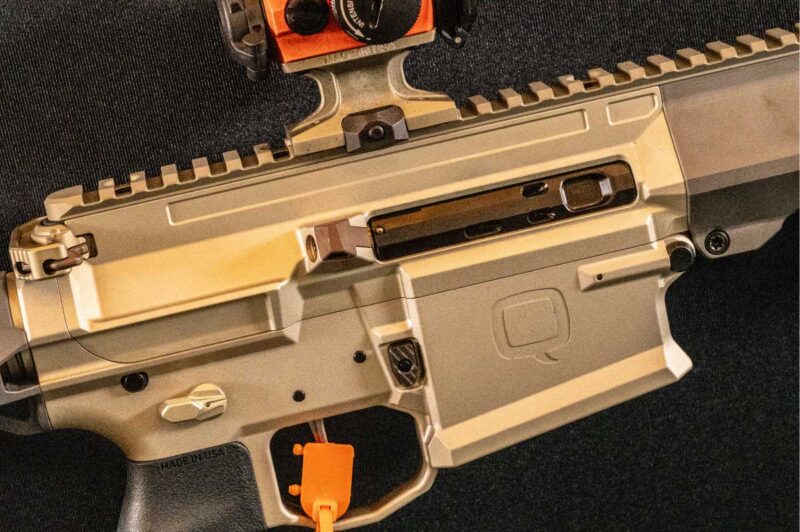 The integrated receiver and rigid handguard system provide enhanced durability and improved mounting stability for optics and accessories.