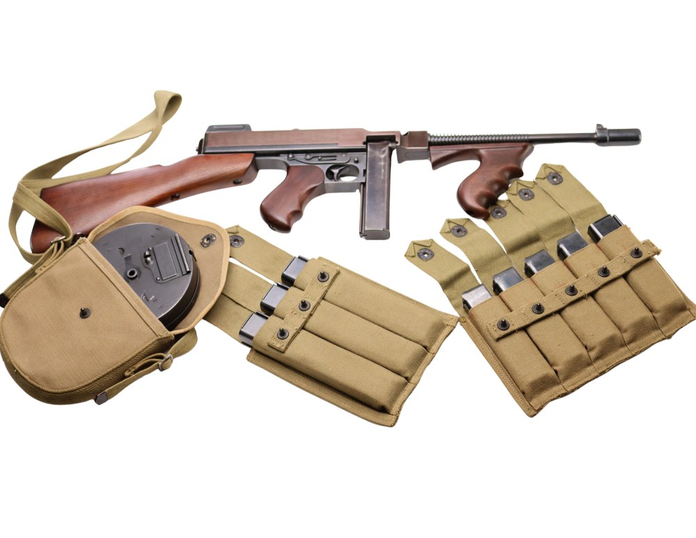 Colt 1921AC Thompson submachine gun with finned barrel and Cutts compensator, one of the most iconic machine guns ever produced.