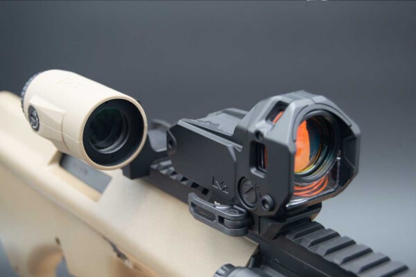 The Meprolight M22 mounts fast and easy on the author’s Steyr AUG. Seen here with the MMX4 magnifier flipped to the side. The Meprolight M22 mounted on Steyr AUG.