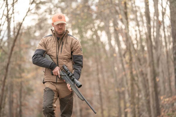man-in-the-woods-with-baretta-brx1-rifle-lifestyle