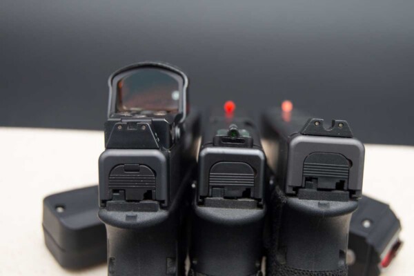 The HiViz FastDot H3 (center) seems to be the perfect sweet spot between the electronic Leupold DeltaPoint red dot sight on the left and the standard three-dot tritium sights from Trijicon on the left. comparing-the-HiViz-FastDot-H3-to-Leupold-DeltaPoint-red-dot-sight-Trijicon-three-dot-tritium